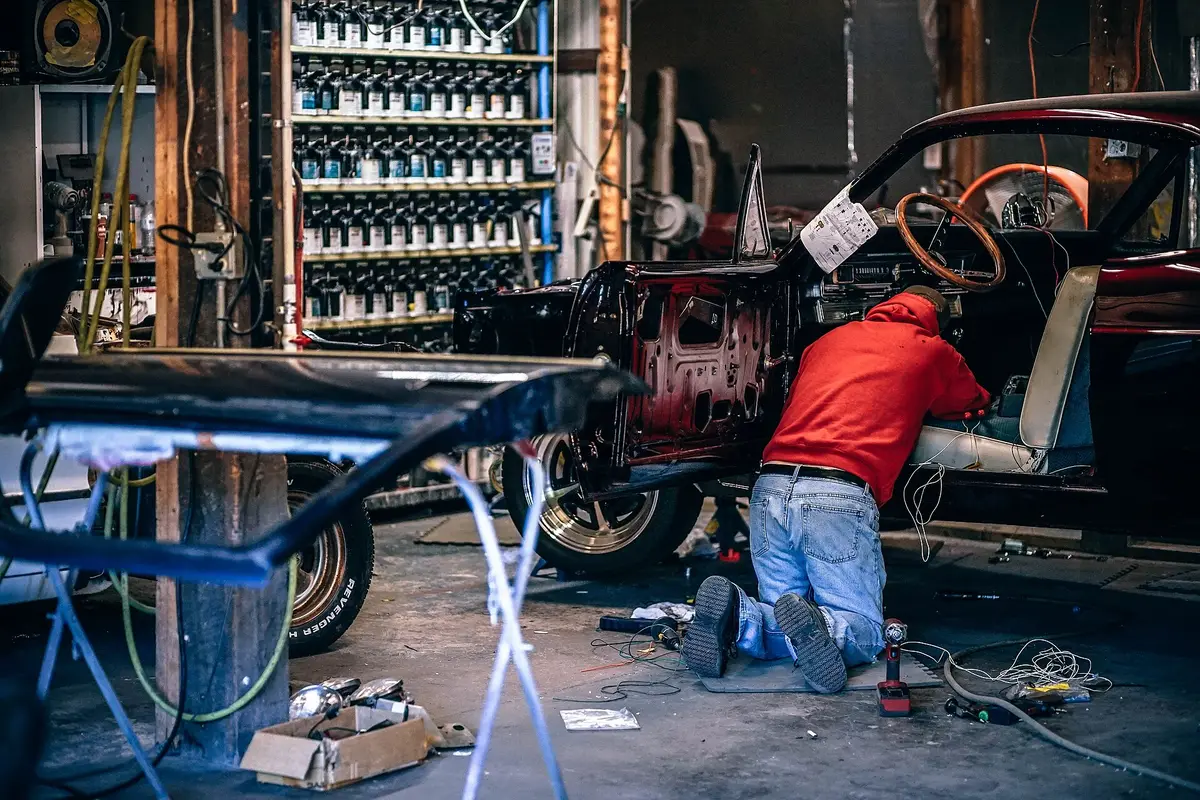 A mechanic working on a car in a workshop