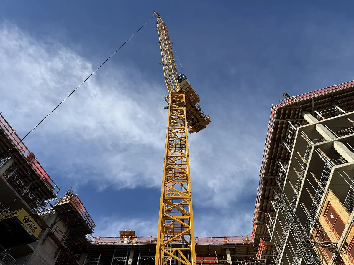 A tower crane over a building under construction